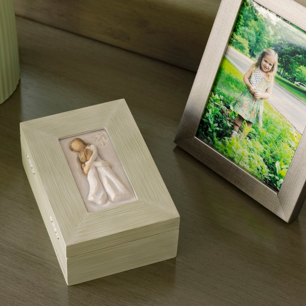 Willow Tree Mother and Daugher Memory Box, 5.25”d x 3.5”w x 2”h hand-painted light gray/blue wood box with bas-relief resin carving of embracing adult and child in cream dresses on hinged lid