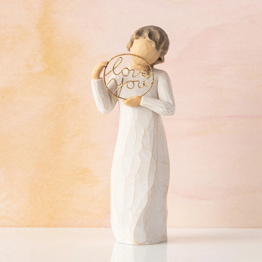Willow Tree Love you, 5.5”h hand-painted standing figure in cream dress, holding gold wire circle with 'love you' inside, in front of peach painting