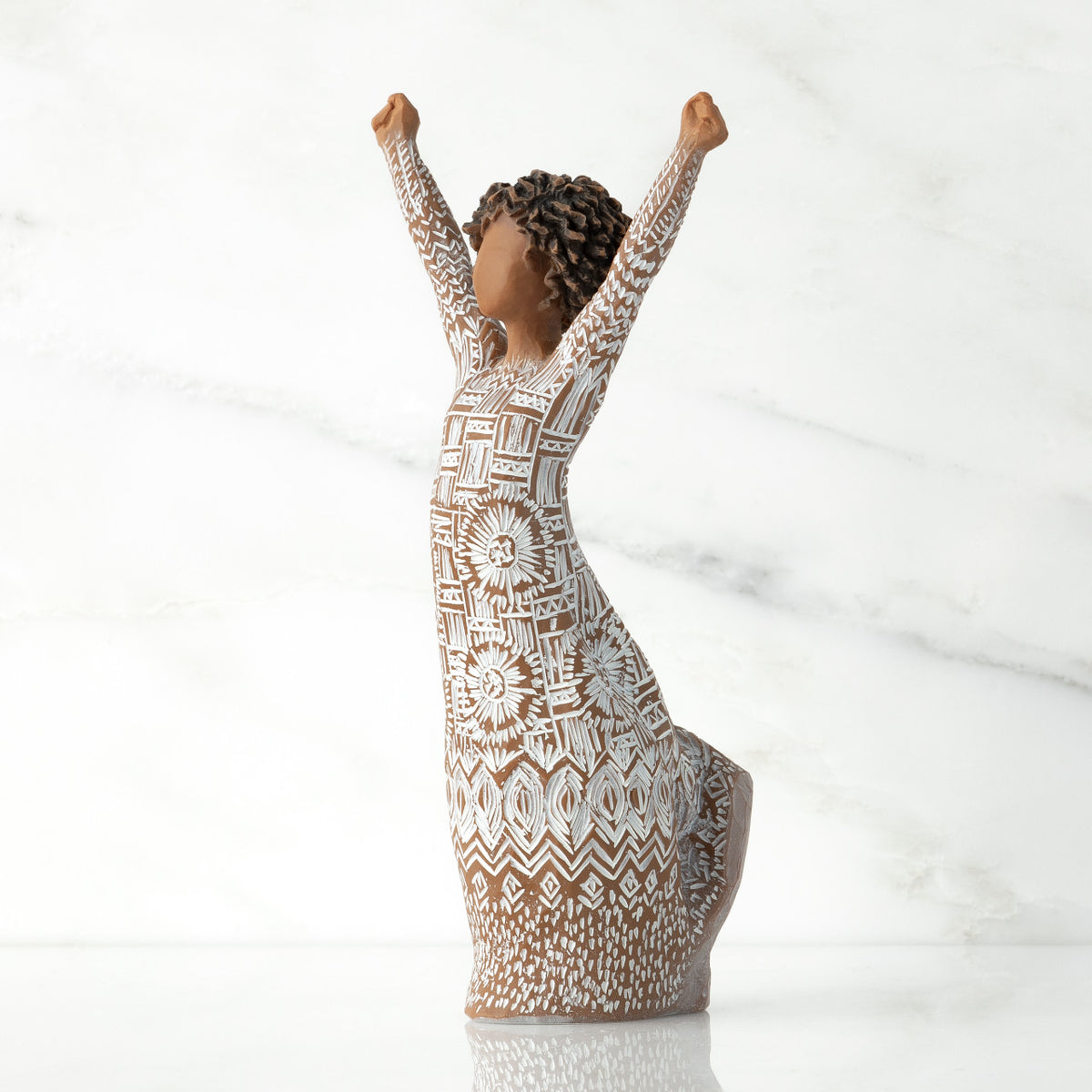 Figure turned to left, with dark natural hairstyle, arms raised overhead, dress entirely etched with African textile patterns