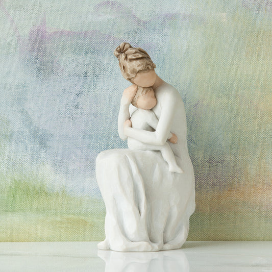 Willow Tree For Always, 6.5”h hand-painted resin female figure, seated, holding toddler on lap, both in cream clothes, arms around each other, in front of blue painting