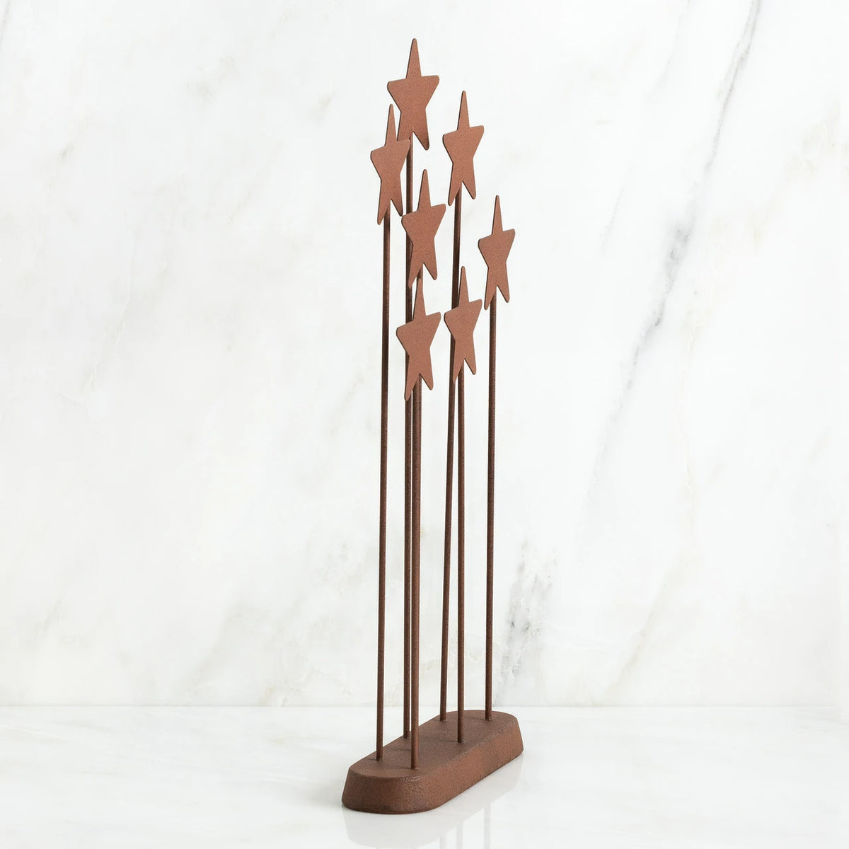 Bronze plaque with star stands on top of it