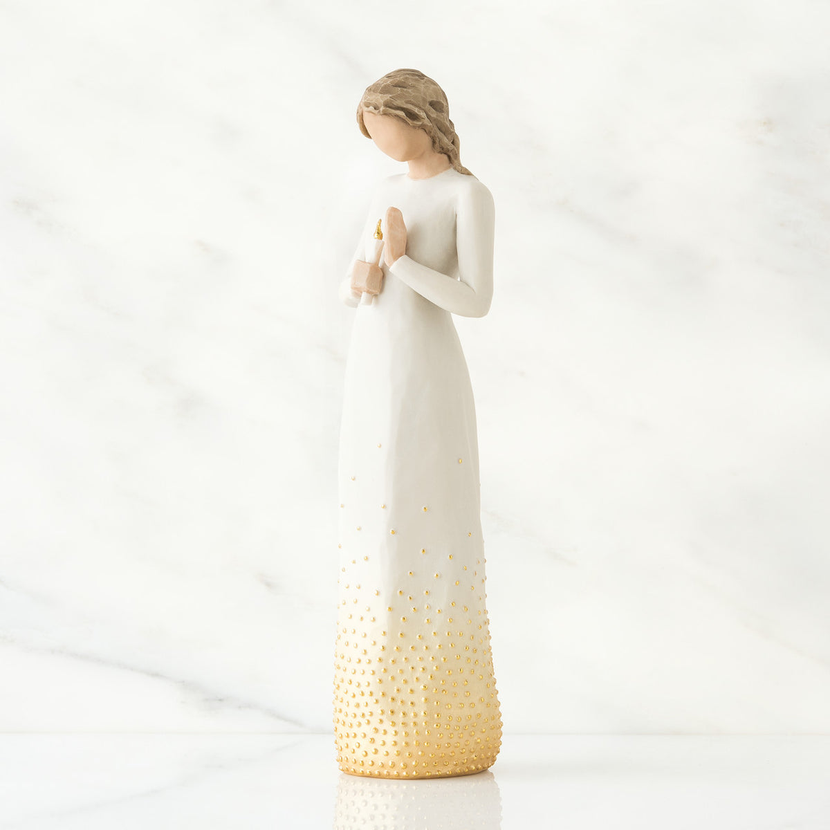 Brunette girl figurine in white dress holding arms up