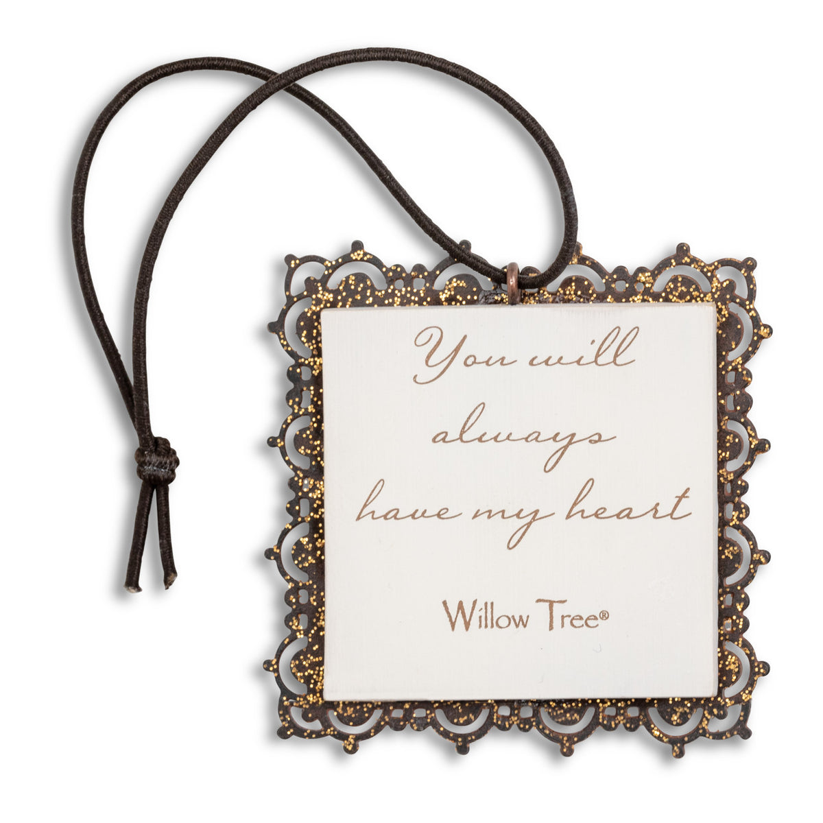 Small square bas-relief carving of boy holding gold heart, edged in pierced-metal filigree with brown elastic ornament loop
