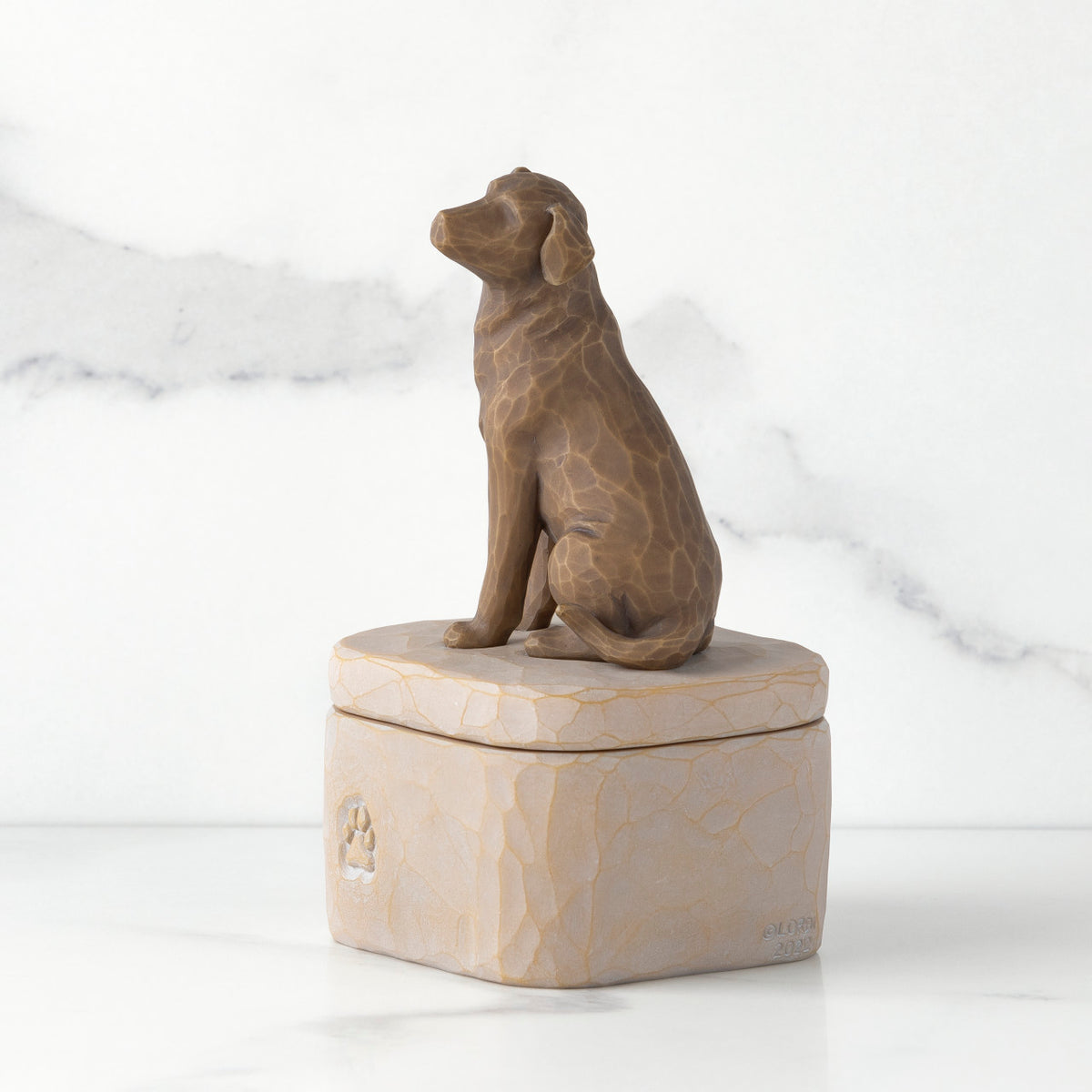 Gray square resin box, 3-D figure of dark dog on lid, paw print carving on side of box