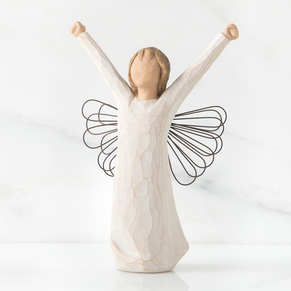Angel faceless figurine wearing white dress with arms up - wings are wire