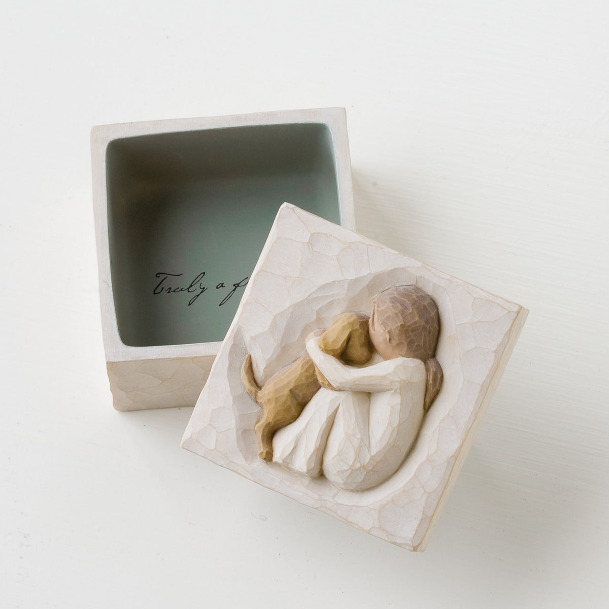 Open square white wooden keepsake box - top of lid is carved in faceless girl holding faceless brown puppy