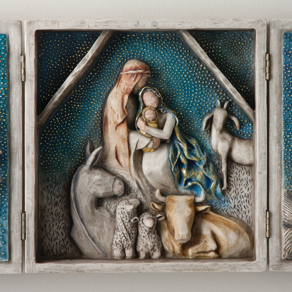 A hinged resin box, done in a Willow Tree format that tells the story of the Nativity