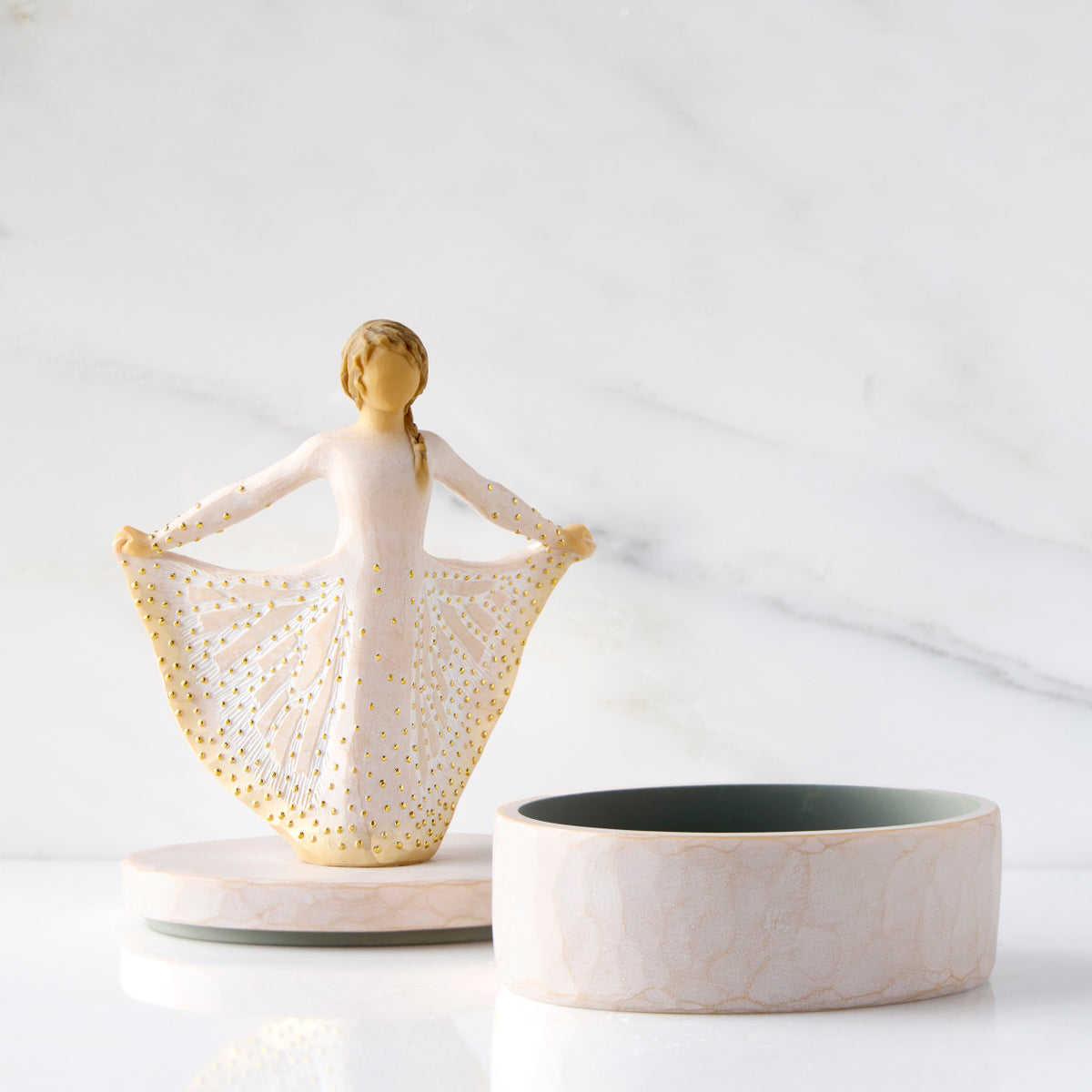 Front view: open oval resin box, showing detached lid with figure next to box base