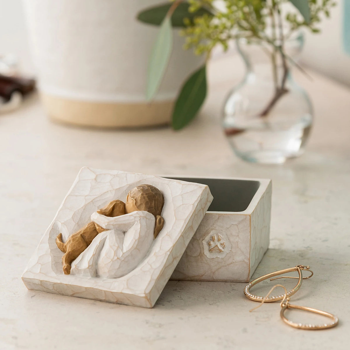 Willow Tree Friendship True Box, 3”sq x 2”h hand-painted resin box with removable lid off to one side, jewelry inside box. Lid has bas-relief carving of seated figure in cream dress, playing with yellow dog, inside of box has sentiment