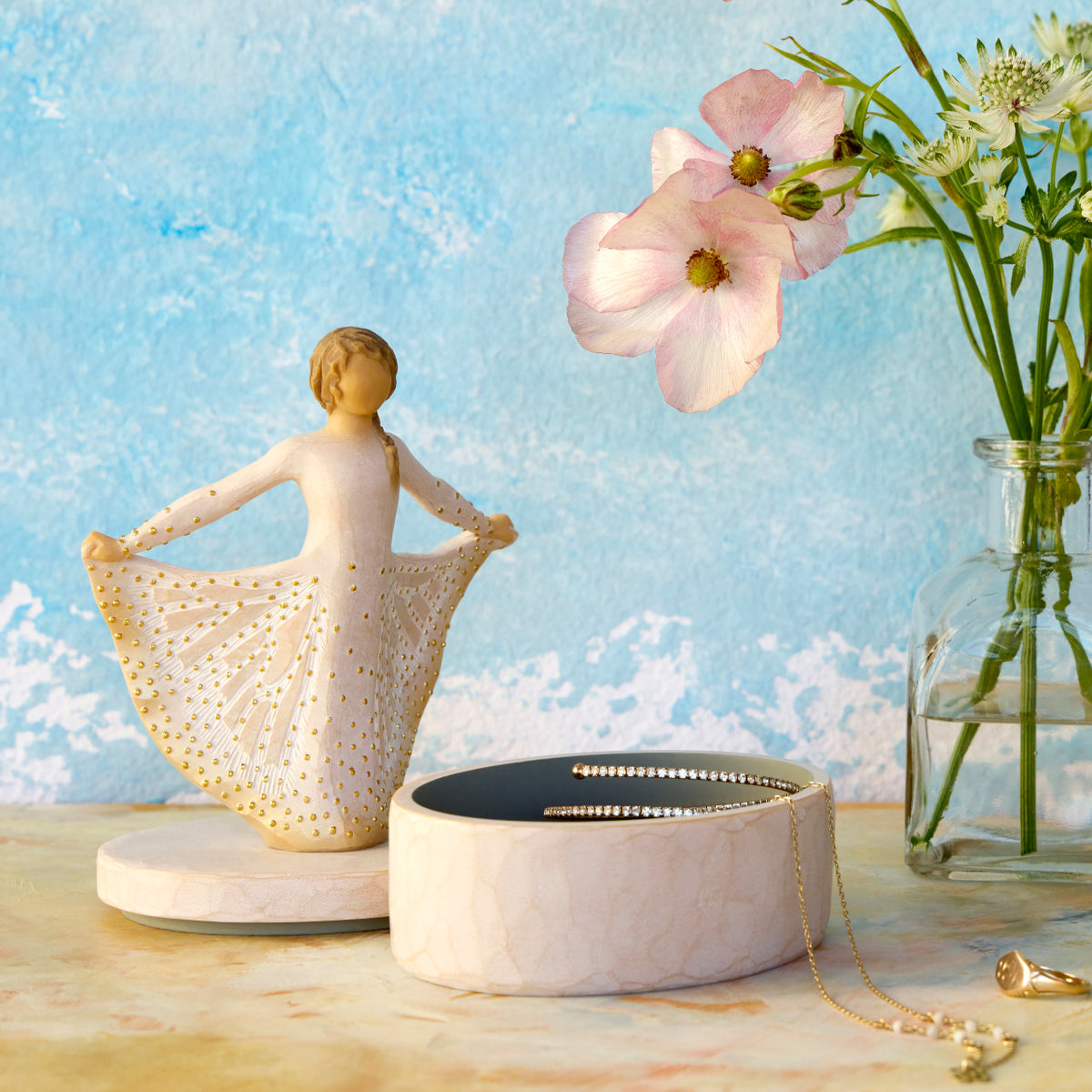 Willow Tree Butterfly Keepsake Box, 6.5"h x 4.5"h hand-painted oval resin box, 4.75”h figure holding cream skirt with carvings of monarch butterfly affixed to lid, open with jewelry inside
