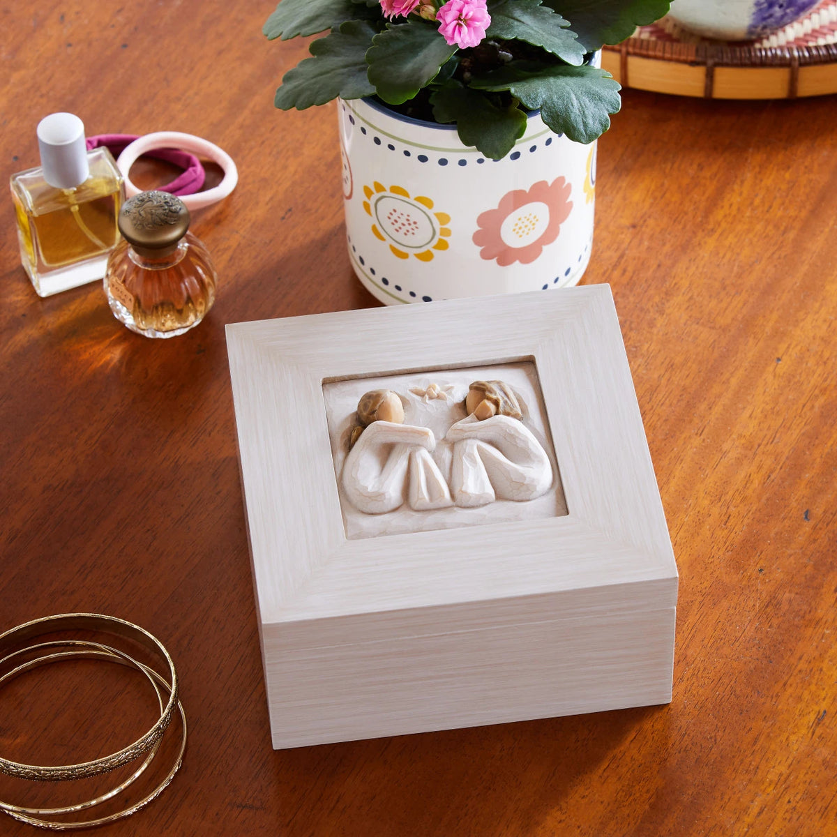 Willow Tree Friendship Music Jewelry Box, 5”sq x 2.5”h hand-painted cream wood box, closed hinged lid has bas-relief resin carving of two seated figures in cream dresses, facing each other, 3.5”sq photograph fits inside lid, blush-colored fabric jewelry partitions inside